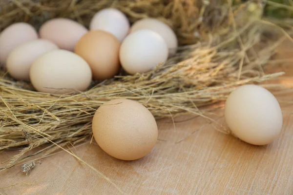 Nest Fresh Raw Eggs Wooden Table Closeup — стоковое фото