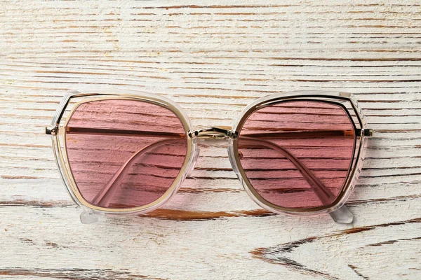 New Stylish Sunglasses White Wooden Table Top View — Fotografia de Stock