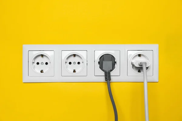 Power Sockets Inserted Plugs Yellow Wall Electrical Supply — Fotografia de Stock