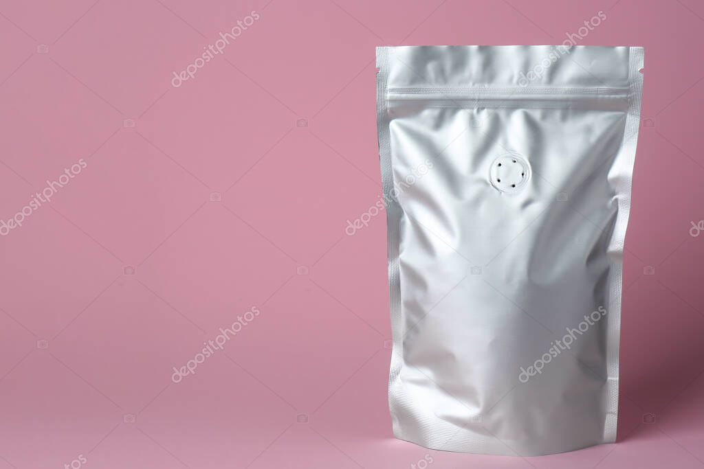 One blank foil package on pink background. Space for text