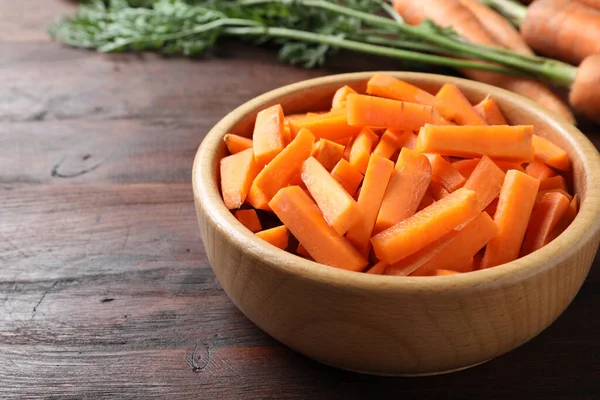 Cut Carrot Bowl Brown Wooden Table Closeup — Stockfoto