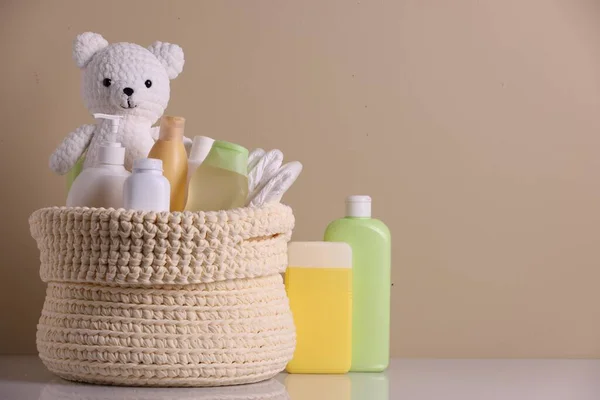 Knitted Basket Baby Cosmetic Products Toy Bear White Table Beige — Stock fotografie