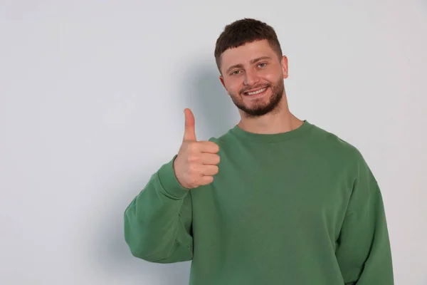 Young Man Showing Thumb White Background Space Text — Stok fotoğraf