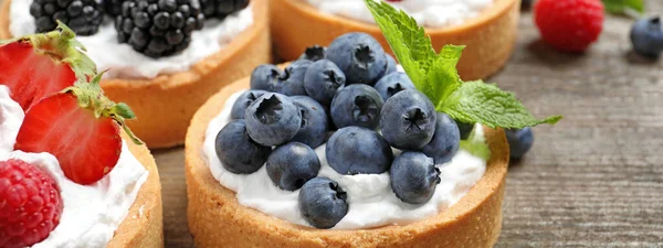 Delicious Tartlets Fresh Berries Wooden Table Closeup Banner Design — Stockfoto
