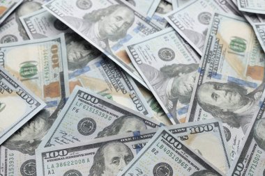 Dollar banknotes as background, closeup view. Money exchange