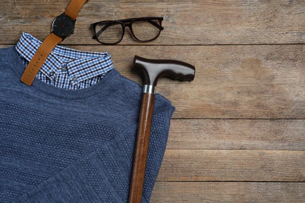 Elegant Walking Cane Sweater Watch Glasses Wooden Table Flat Lay — Stock Fotó