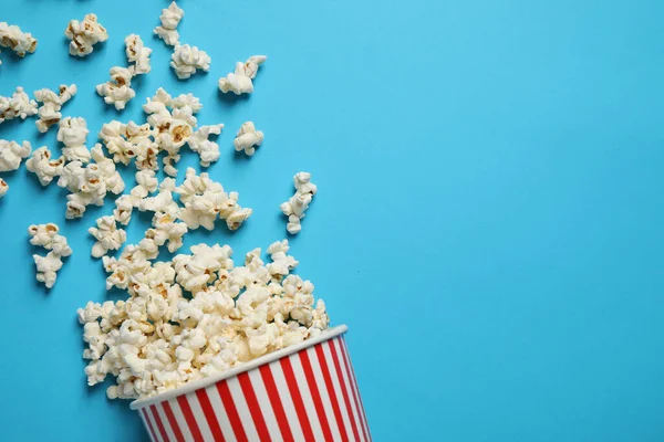 Delicious Popcorn Light Blue Background Top View Space Text — Stock Photo, Image