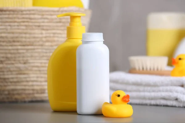 Baby Cosmetic Products Rubber Duck Grey Table — Stockfoto