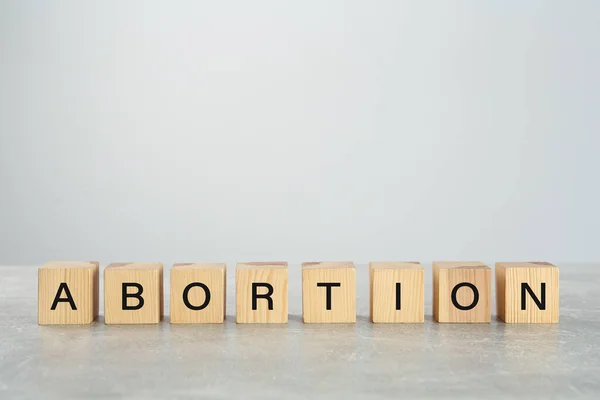 Word Abortion Made Wooden Cubes Grey Table — Stockfoto