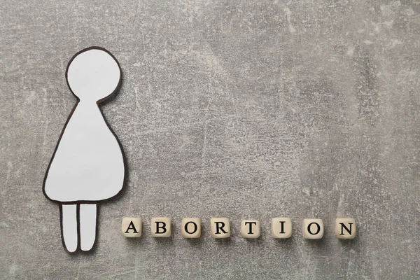 Word Abortion Made Wooden Cubes Pregnant Woman Paper Cutout Grey — Φωτογραφία Αρχείου