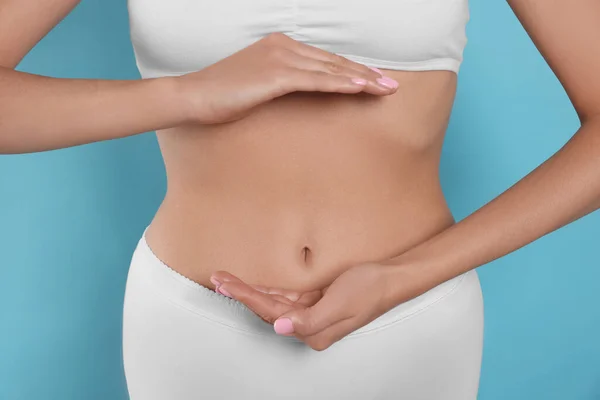 Woman Underwear Holding Something Her Belly Light Blue Background Closeup — Stock fotografie