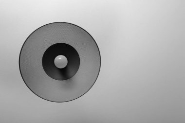 White ceiling with modern lamp, bottom view. Space for text