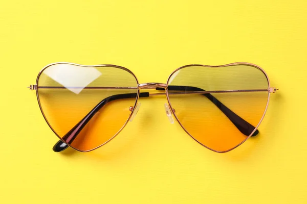 Stylish Elegant Heart Shaped Sunglasses Yellow Background Top View — Fotografia de Stock