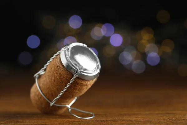 Sparkling Wine Cork Muselet Cap Blurred Festive Lights Closeup Space — стоковое фото