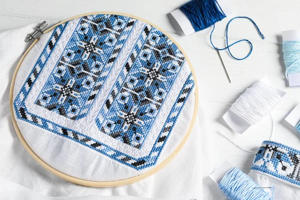 Shirt Blue Embroidery Design Hoop Needle Threads White Wooden Table — Fotografia de Stock