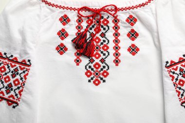 Beautiful white shirt with red Ukrainian national embroidery, top view