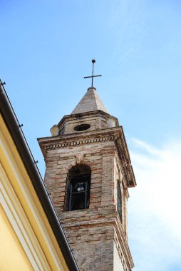 Beautiful church with tower against blue sky, low angle view