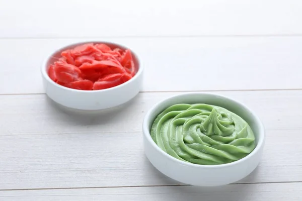 Bowls Swirl Wasabi Paste Pickled Ginger White Wooden Table Closeup — Stock fotografie