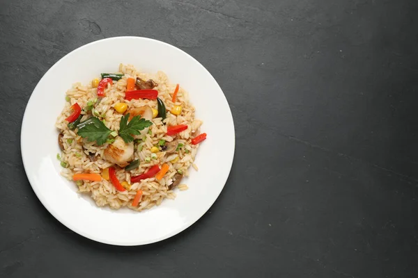Delicious Rice Pilaf Chicken Vegetables Black Table Top View Space — Stockfoto