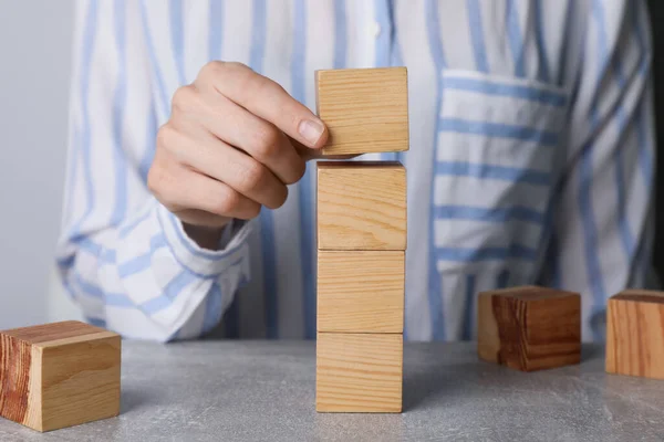 Woman Stacking Wooden Cubes Table Closeup Management Concept — Photo