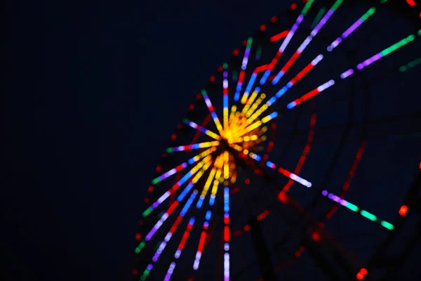 Blurred View Beautiful Glowing Ferris Wheel Dark Sky Space Text — Stock Fotó