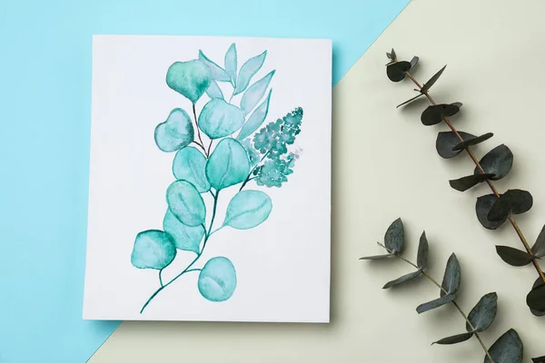 Beautiful drawing of plants near eucalyptus branches on color background, flat lay
