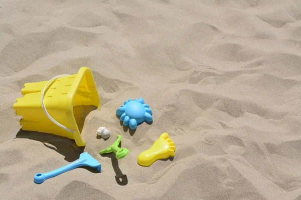 Bright Plastic Bucket Rake Shovel Sand Beach Toys Space Text — Zdjęcie stockowe