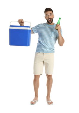 Emotional man with cool box and bottle of beer on white background