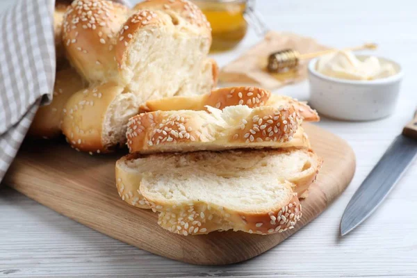 Cut Freshly Baked Braided Bread Knife Butter White Wooden Table — Fotografia de Stock