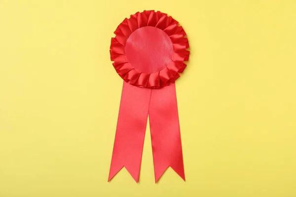 Red Award Ribbon Yellow Background Top View — Stok fotoğraf