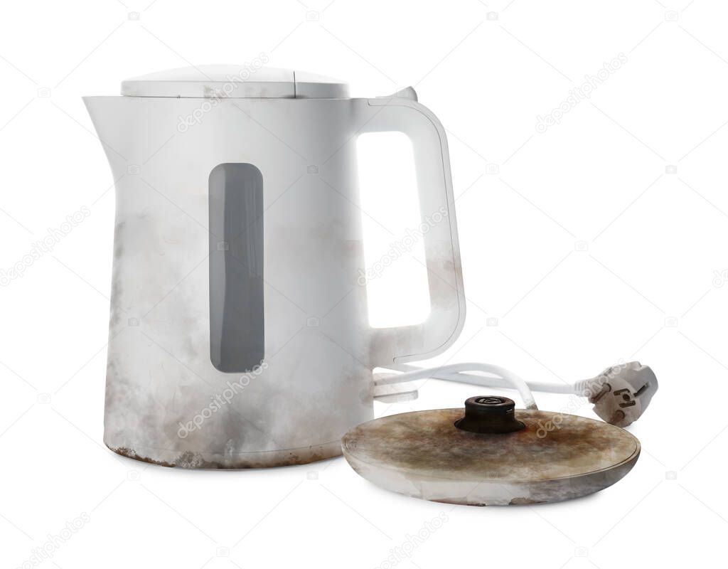 Burnt electric kettle with base and plug on white background