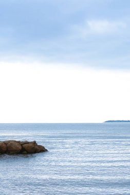 Beautiful view on sea with rock breakwater