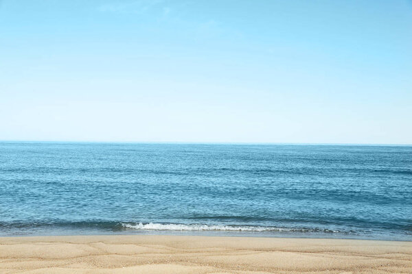 Picturesque view of sandy beach near sea