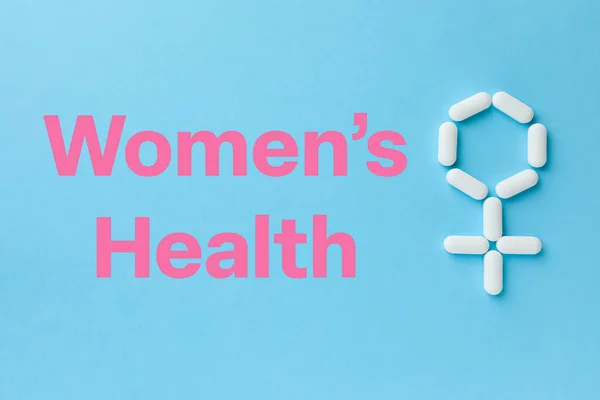 Words Women Health Female Symbol Made Pills Light Blue Background — ストック写真