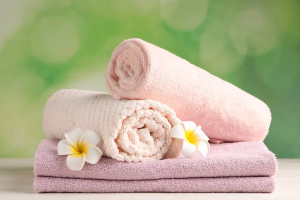 Soft Folded Towels Plumeria Flowers White Wooden Table — Stock Fotó