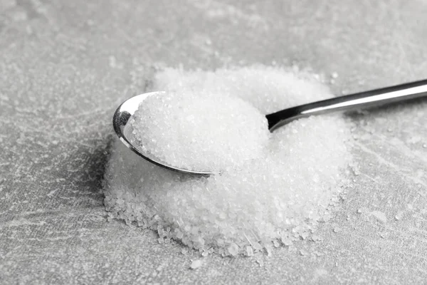 Granulated Sugar Spoon Light Grey Table Closeup — Zdjęcie stockowe