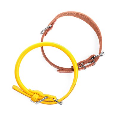 Different leather dog collars on white background, top view