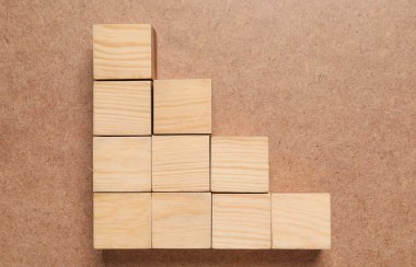 Many cubes on wooden background, flat lay. Management concept