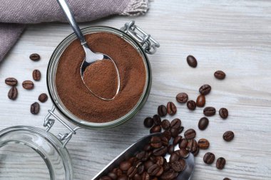 Flat lay composition with instant coffee on white wooden table
