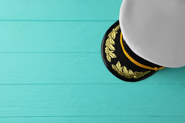 Peaked Cap Accessories Turquoise Wooden Background Top View Space Text — Foto de Stock