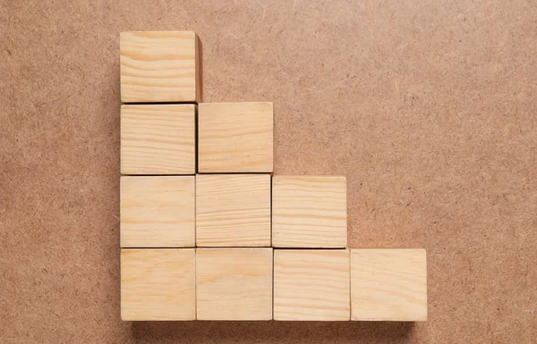 Many cubes on wooden background, flat lay. Management concept
