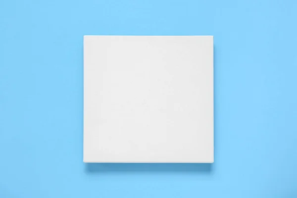 Blank canvas on light blue background, top view. Space for design