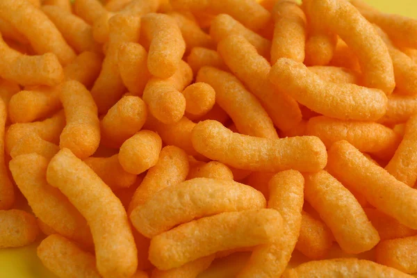 Tasty Cheesy Corn Puffs Background Closeup —  Fotos de Stock