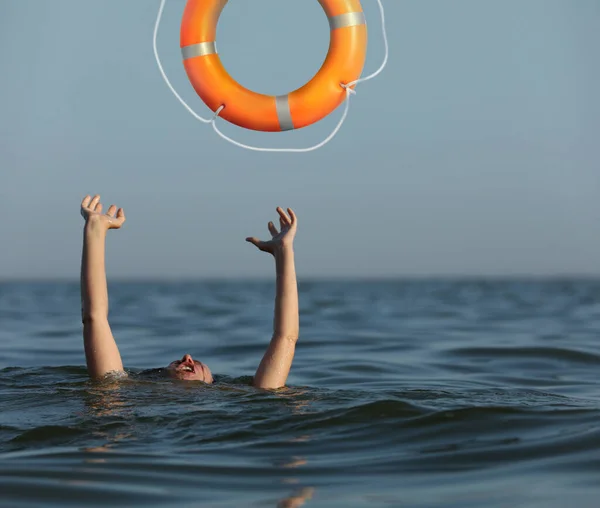 Drowning Woman Raised Hands Getting Lifebelt Sea — Stockfoto
