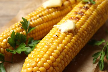 Tasty grilled corn with butter, closeup view