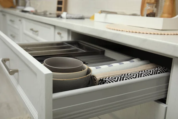 Open Drawer Kitchen Cabinet Different Dishware Towels Closeup — 图库照片