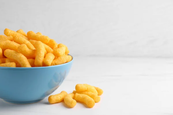 Many Tasty Cheesy Corn Puffs White Marble Table Space Text — Stockfoto