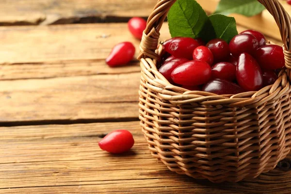 Fresh Ripe Dogwood Berries Green Leaves Wicker Basket Wooden Table — 图库照片