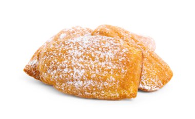 Delicious madeleine cakes with powdered sugar on white background
