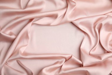 Arka plan olarak narin pembe ipeğin dokusu, üst görünüm